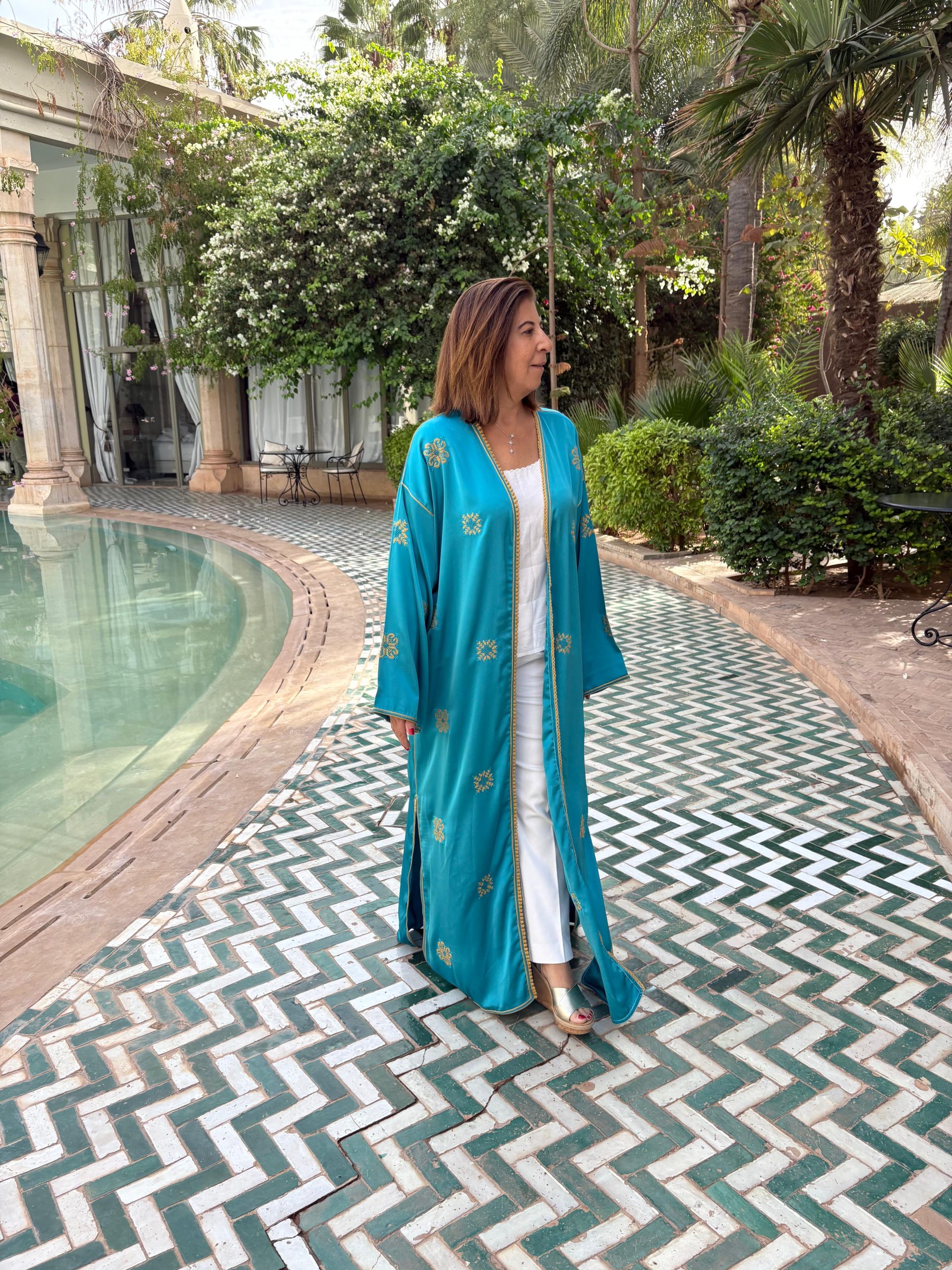 Silk abaya with a delicate touch of Palestinian embroidery Silk abaya with a delicate touch of Palestinian embroidery - Image 1