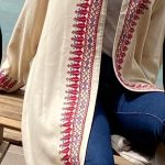 Long jacket adorned with handcrafted Palestinian embroidery